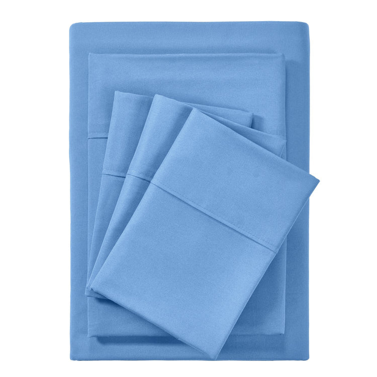 Set of blue bed sheets and pillowcases on a white background