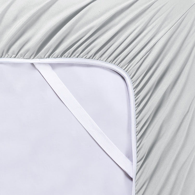 Close-up of a fitted sheet with a subtle pattern on a white background