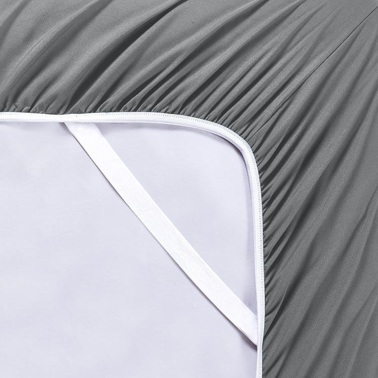Gray fitted sheet on a white mattress