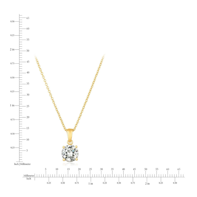 Gold necklace with a diamond pendant on a white background with measurement scale.