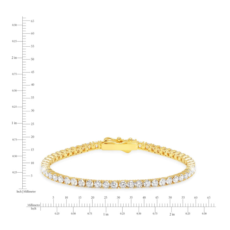 Gold bracelet with diamonds on a white background with measurement scale