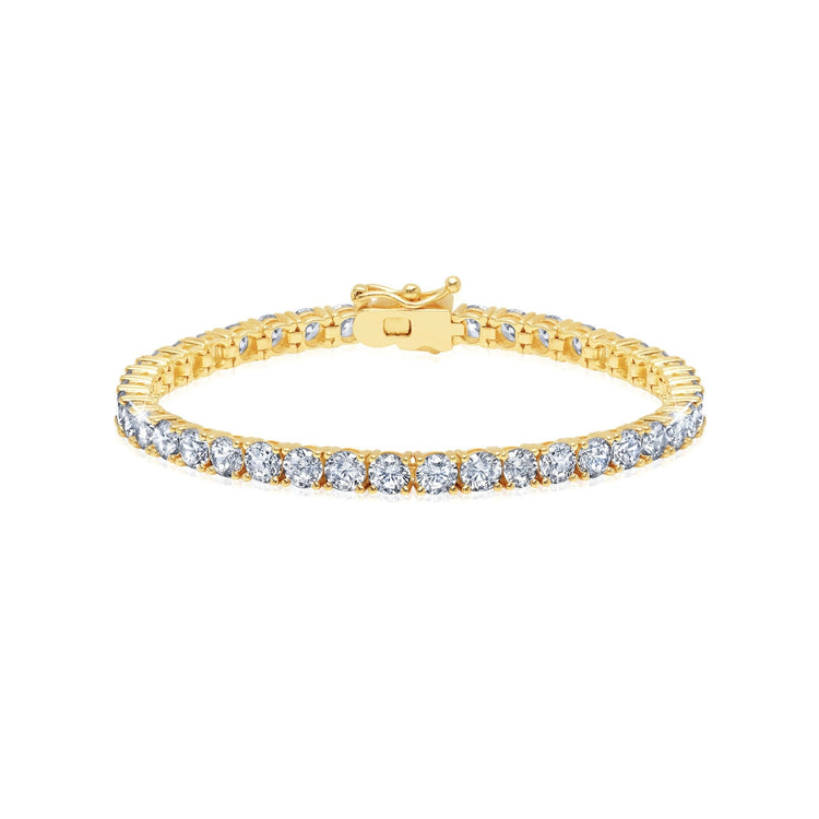 Gold bracelet with clear gemstones on a white background