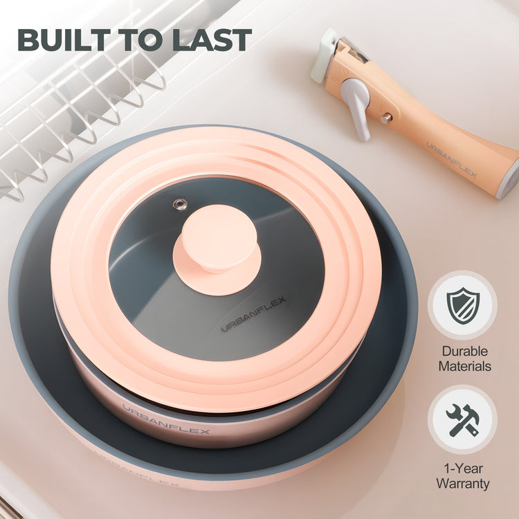 Pink and gray kitchen tool with 'BUILT TO LAST' text and durability icons on a light background