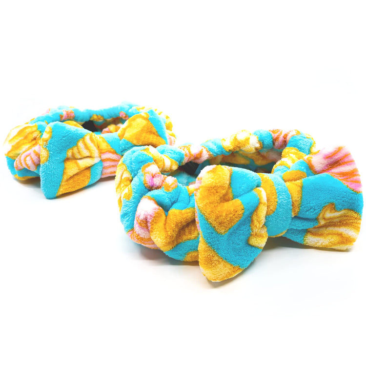 Colorful dog toys with a knotted design on a white background
