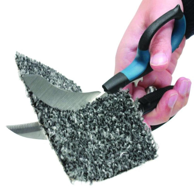 Hand holding a knife with a steel wool pad on a white background