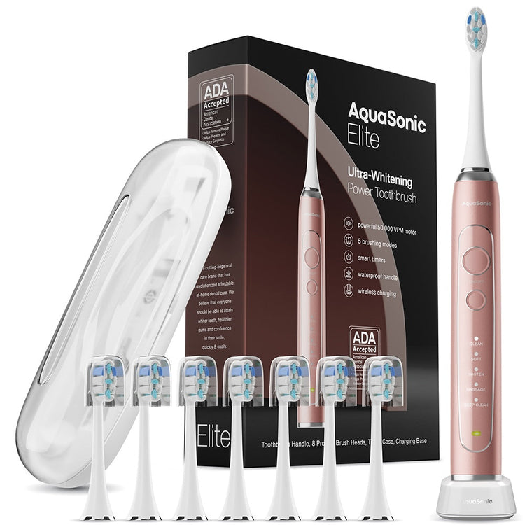 AquaSonic Elite power toothbrush set with packaging, brush heads, and charging case on a white background.