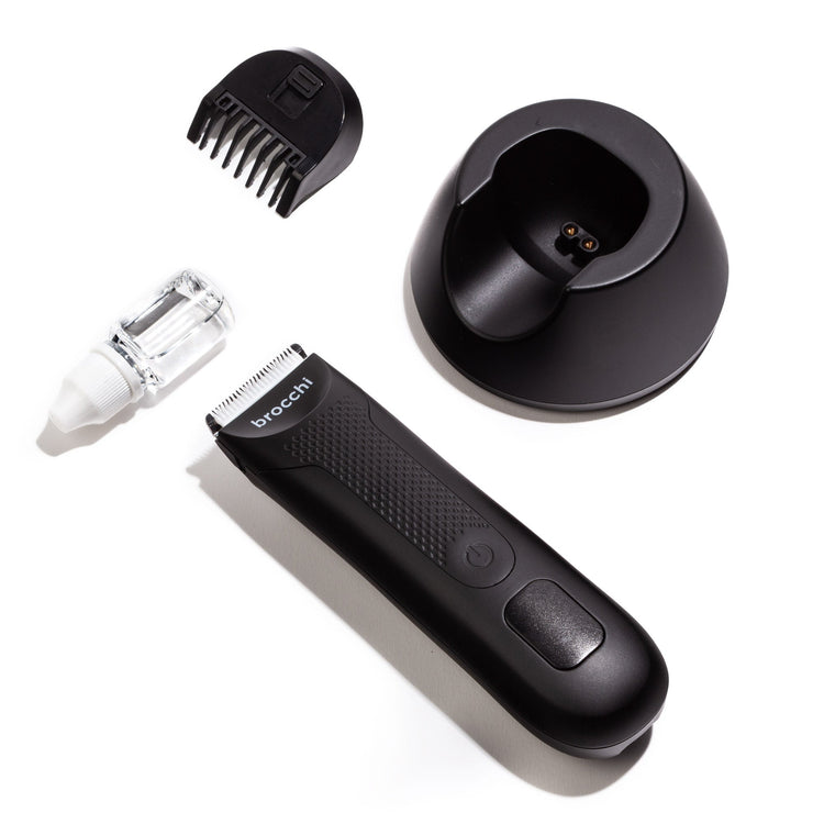 Black grooming tool set with attachments on a white background