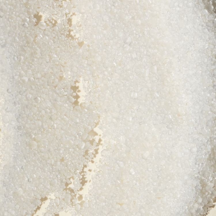 Close-up of a textured beige stone surface