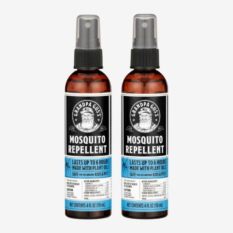 Two bottles of Grandpa Gus' Mosquito Repellent on a white background