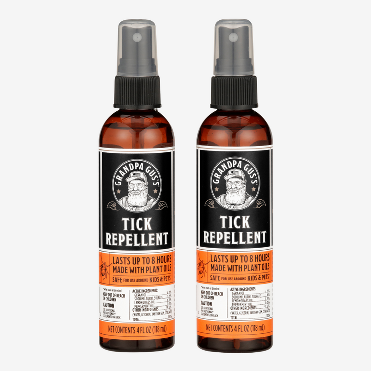 Two bottles of Grandpa Gus' Tick Repellent on a white background