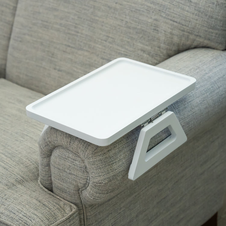 White tray attached to a gray sofa