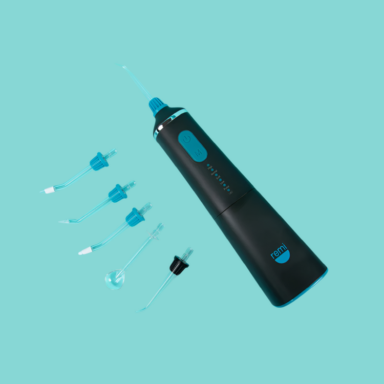 Black ear cleaning device with attachments on a teal background