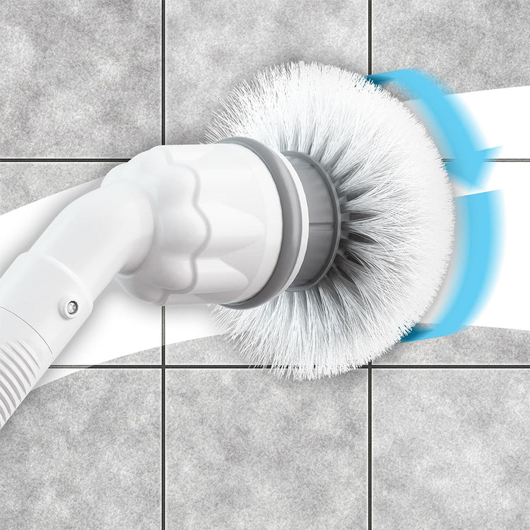Cleaning brush with bristle head and white handle cleaning a tiled surface.