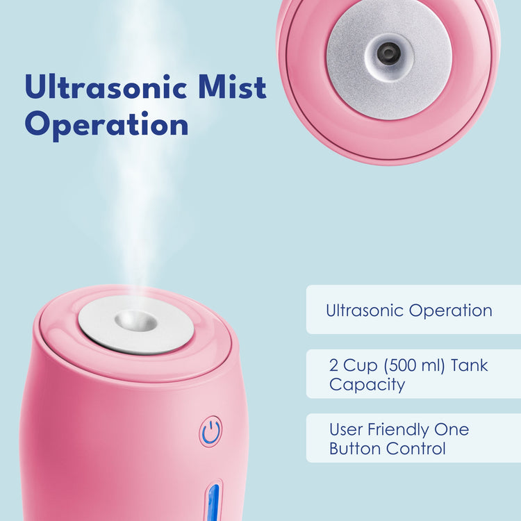 Pink ultrasonic humidifier with mist output on a light blue background