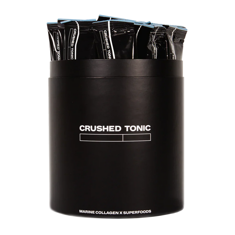 Black container with 'CRUSHED TONIC' branding holding multiple black packets on a white background.
