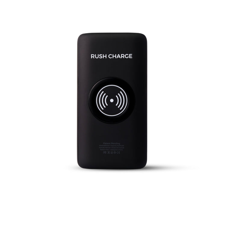 A portable power bank with a attached UV light sanitizing device, and cables connected to a smartphone and earbuds, placed on an outdoor surface.