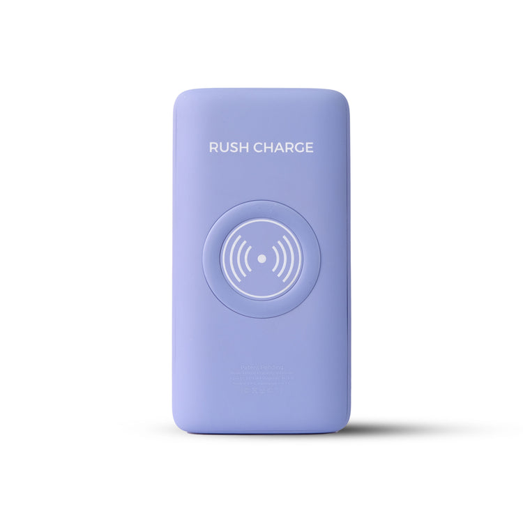 A portable power bank with a attached UV light sanitizing device, and cables connected to a smartphone and earbuds, placed on an outdoor surface.