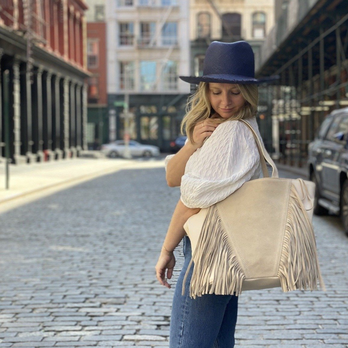 Model wearing Vanilla Fringe Tote