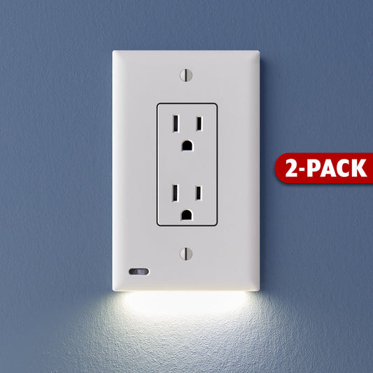A white 2-pack of GuideLight outlet cover plates with built-in LED lights, mounted on a blue wall with the outlets visible at the bottom.
