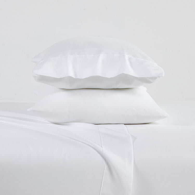 White pillowcases on a light gray background