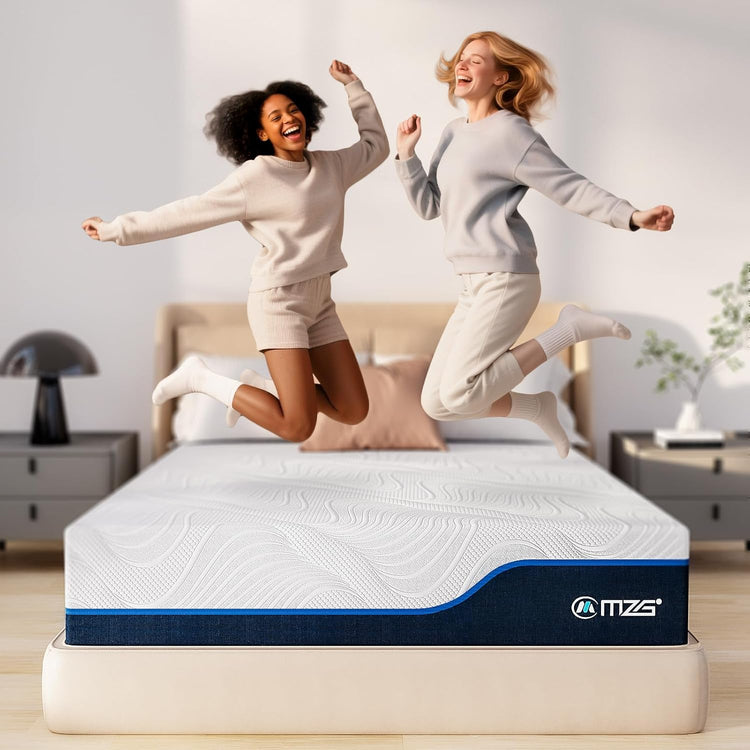 Two women jumping on a mattress with MZS logo in a bedroom setting