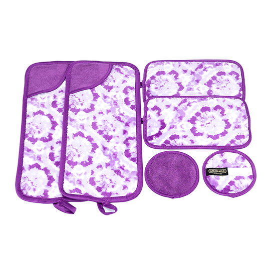 Purple and white patterned travel set with a pouch, two bags, and two round containers on a white background.