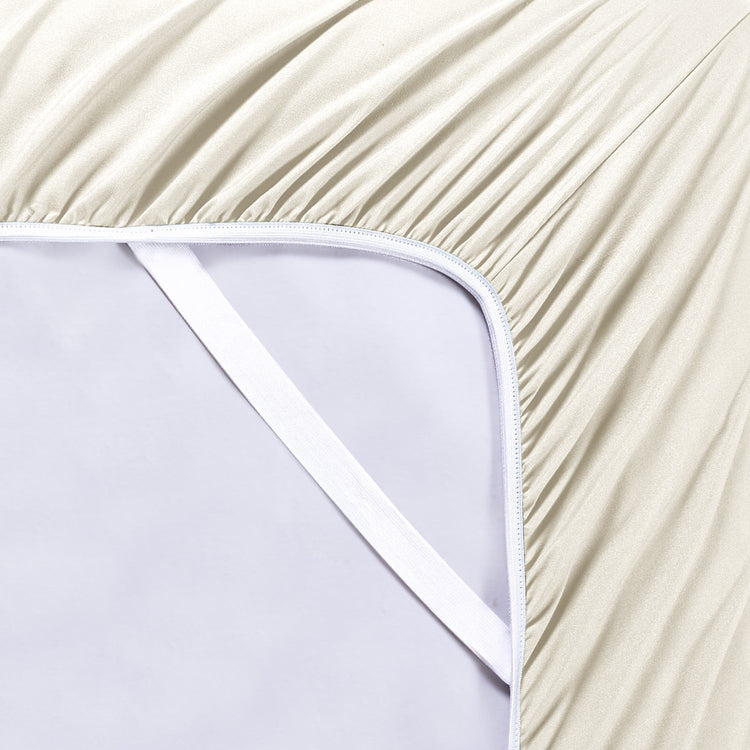Close-up of a fitted sheet on a bed with a white background