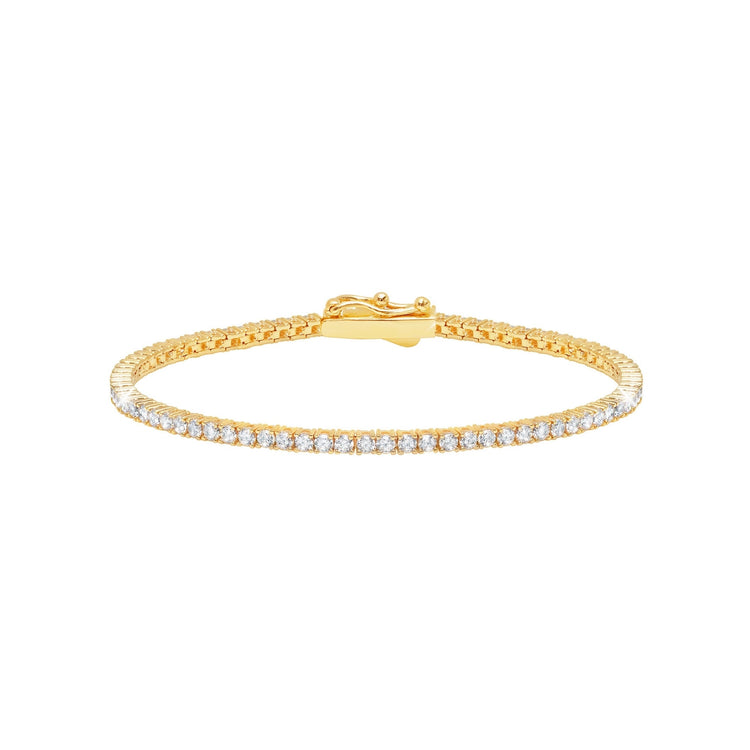 Gold bracelet with clear stones on a white background