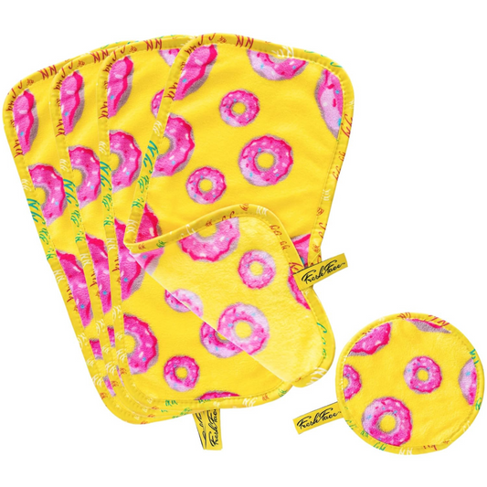 Set of yellow potholders with pink donut pattern on a white background