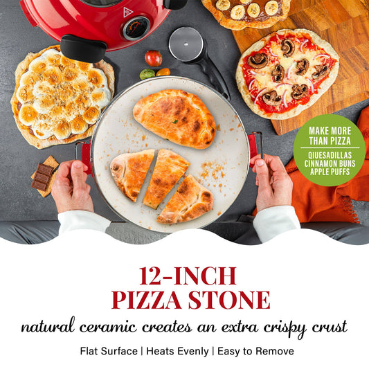 A red countertop pizza oven with a 12-inch pizza on it, surrounded by various accessories such as a carrying case, a pizza peel, a brush, a scraper, and a dough roller.