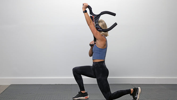 Person exercising with resistance bands against a plain background