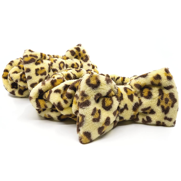 Leopard print bow ties on a white background
