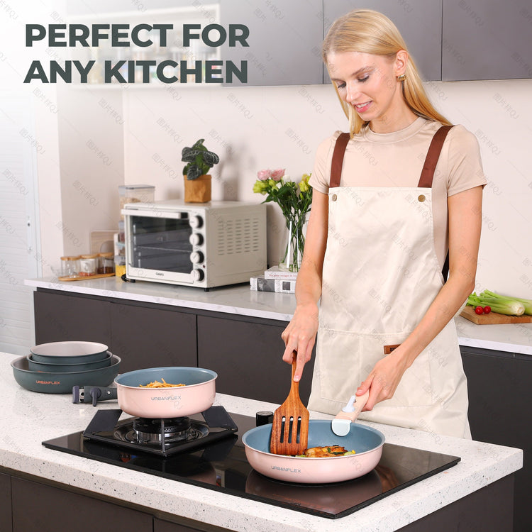 Woman cooking in a modern kitchen with cookware and utensils.
