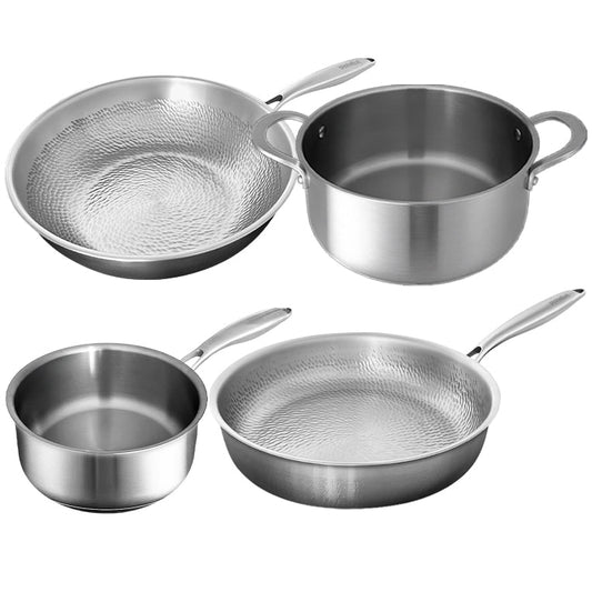 Set of stainless steel cookware including a frying pan, saucepan, and two smaller pots on a white background.