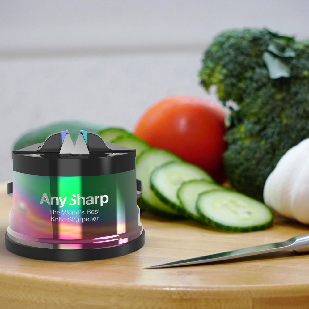 Any Sharp knife sharpener on a cutting board with vegetables in the background