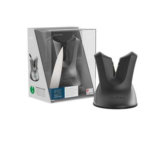 A black, professional knife sharpener with a suction cup base and a metallic blade.