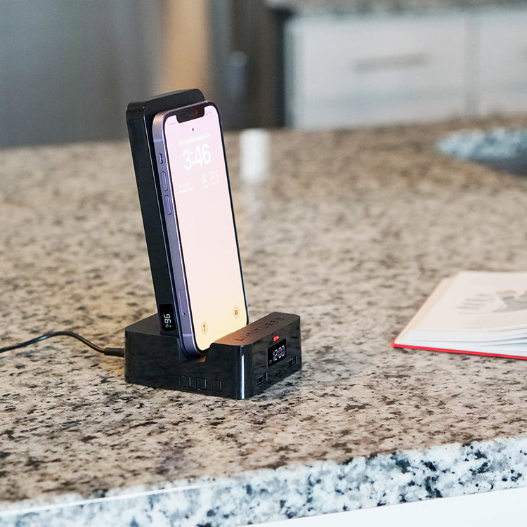 Phone dock with smartphone on a granite countertop