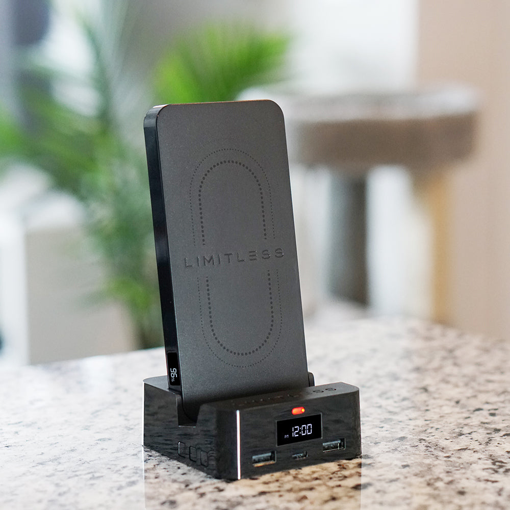 Wireless charging station with digital clock on a surface