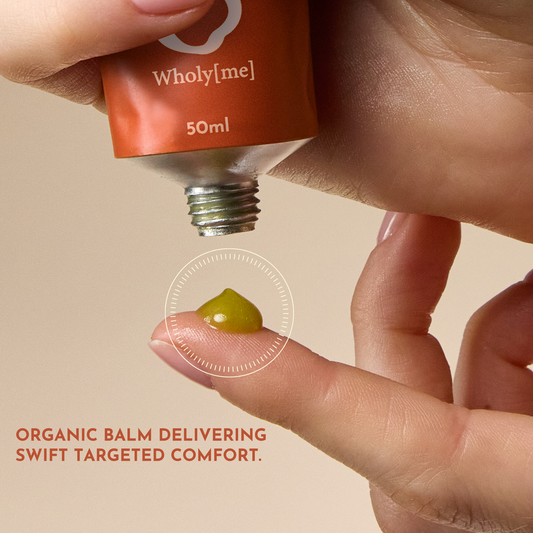 Brown tube of 'Relief Balm' by Wholistic on a white background