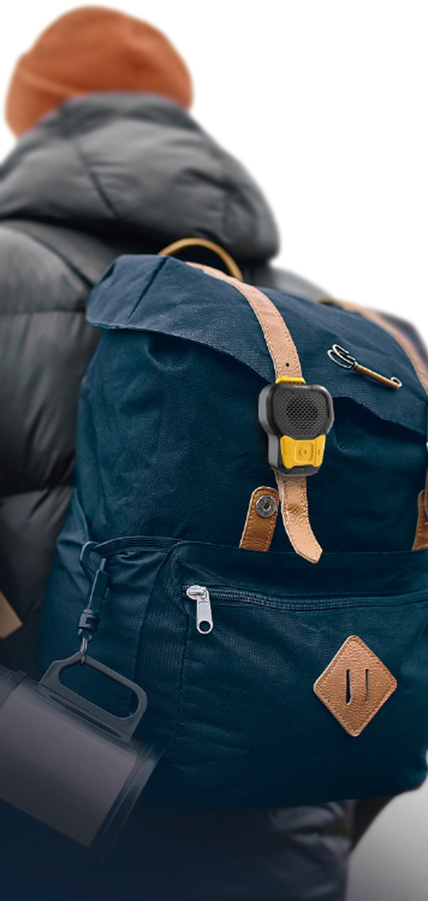 Person wearing a blue backpack with a yellow tag on a white background