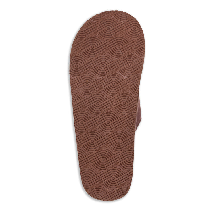 Brown sandal sole with wavy pattern on a white background