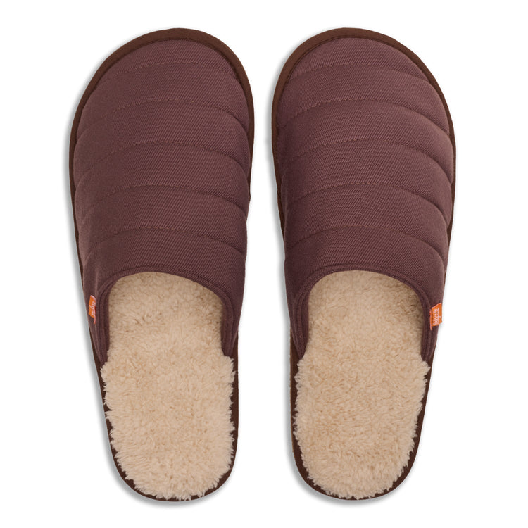 Pair of brown slippers with plush lining on a white background