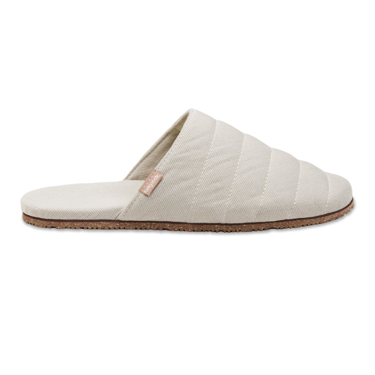 Beige quilted slipper on a white background