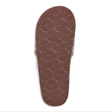 Brown sandal sole with wavy pattern on a white background