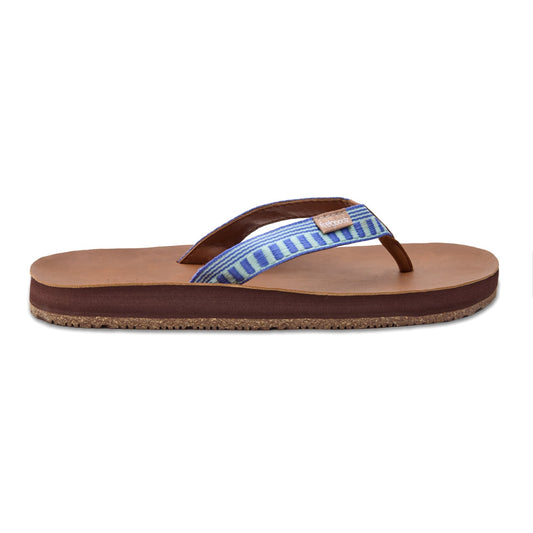 Pair of brown sandals with blue striped straps on a white background