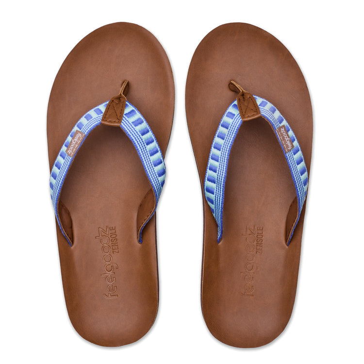 Pair of brown sandals with blue straps on a white background