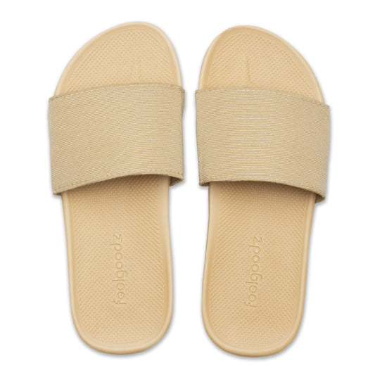 Beige slide sandals with a brand logo on a white background
