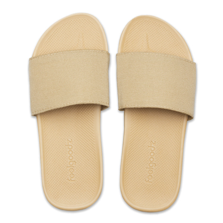 Beige slides with elastic straps on a white background