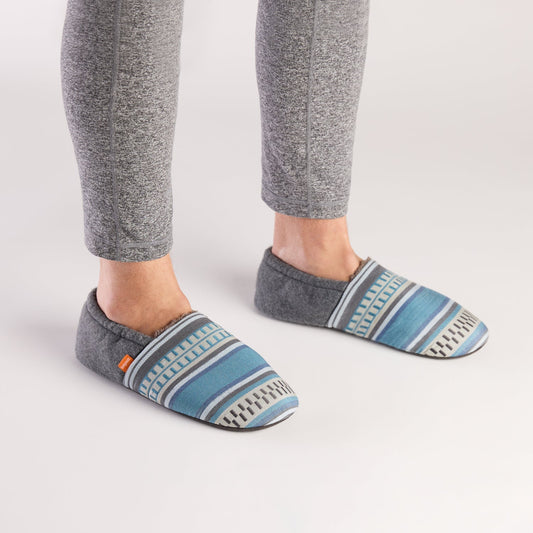 Pair of gray and blue striped slippers on a white background