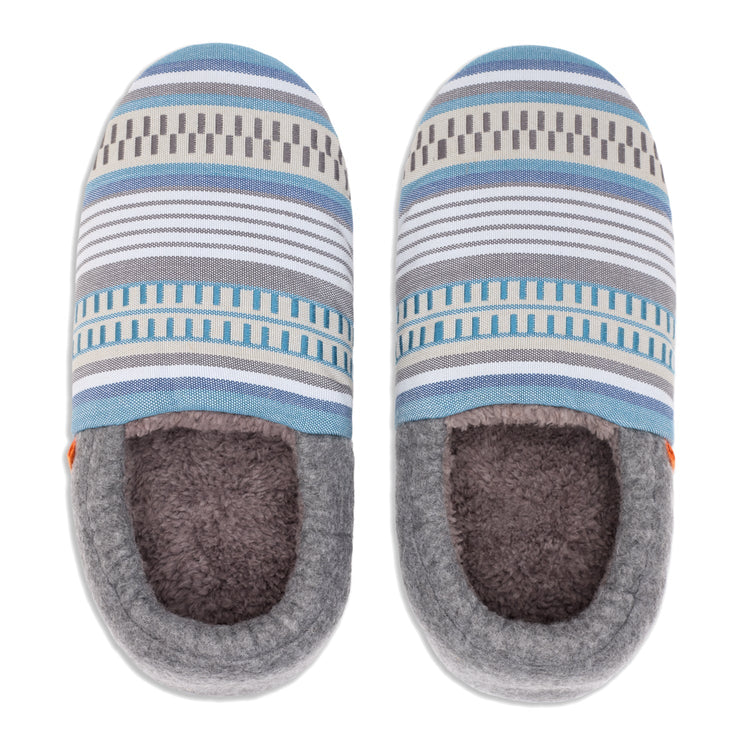Pair of striped slippers with gray sole on a white background